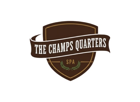 Shield-shaped logo with a ribbon banner reading 'The Champs Quarters' and 'SPA' below.