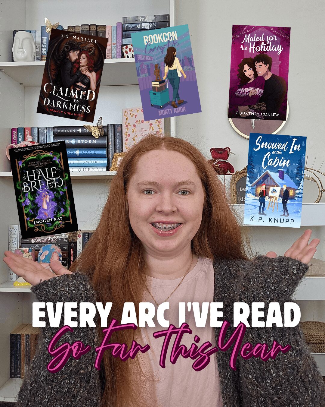 Red-haired woman smiling with books hanging above her, shelves in background, arms outstretched.