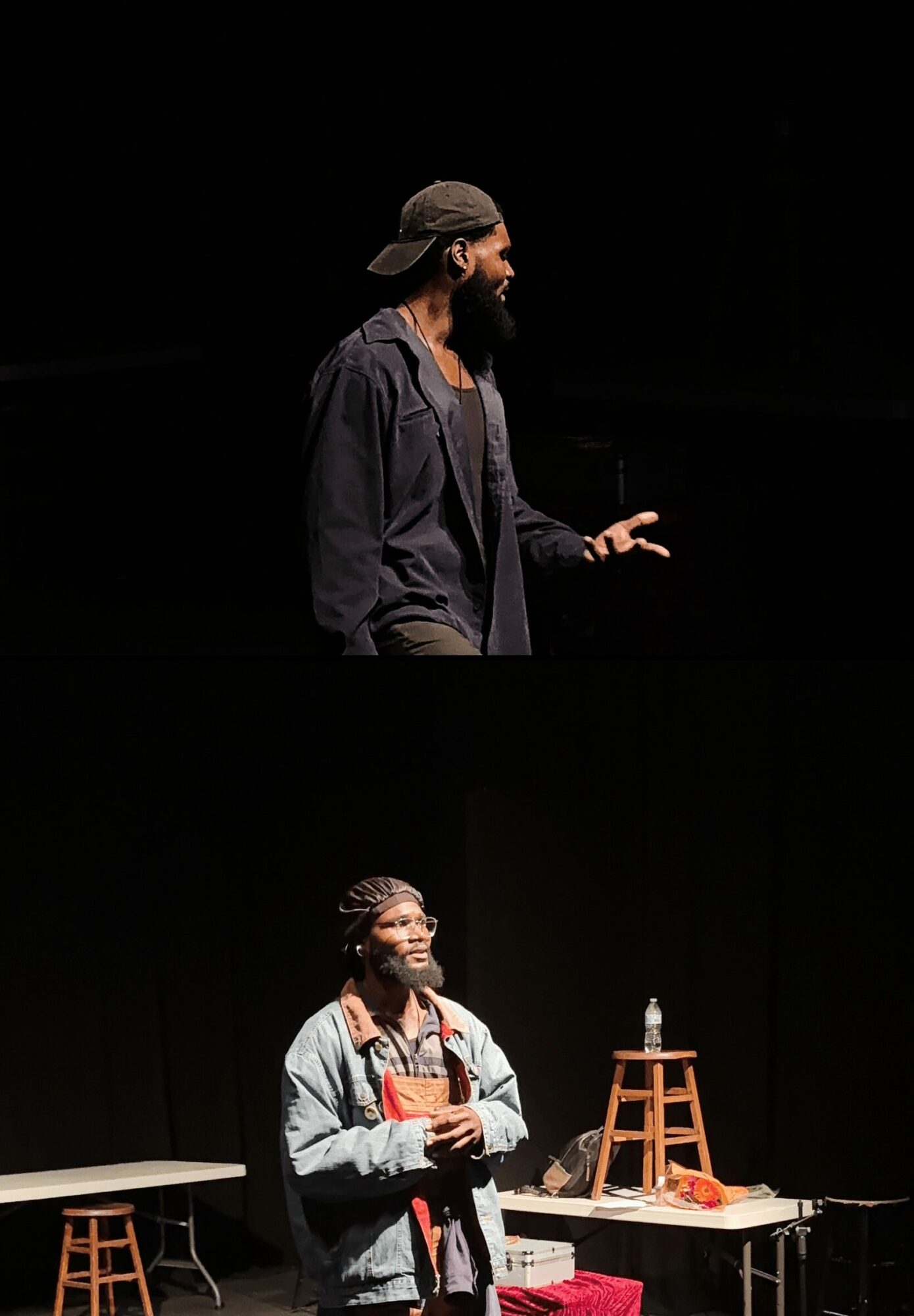 Two people on stage, one speaking and the other holding a microphone, with stools and a small table nearby.