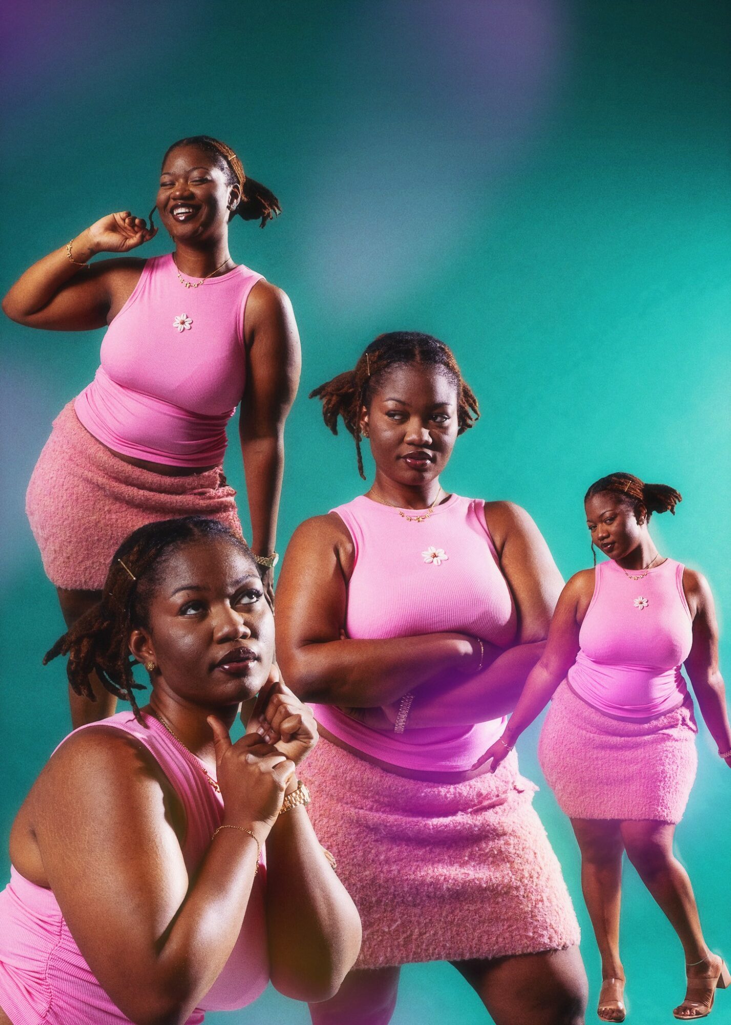 Four women in pink dresses pose against a colorful background, smiling and looking at the camera.