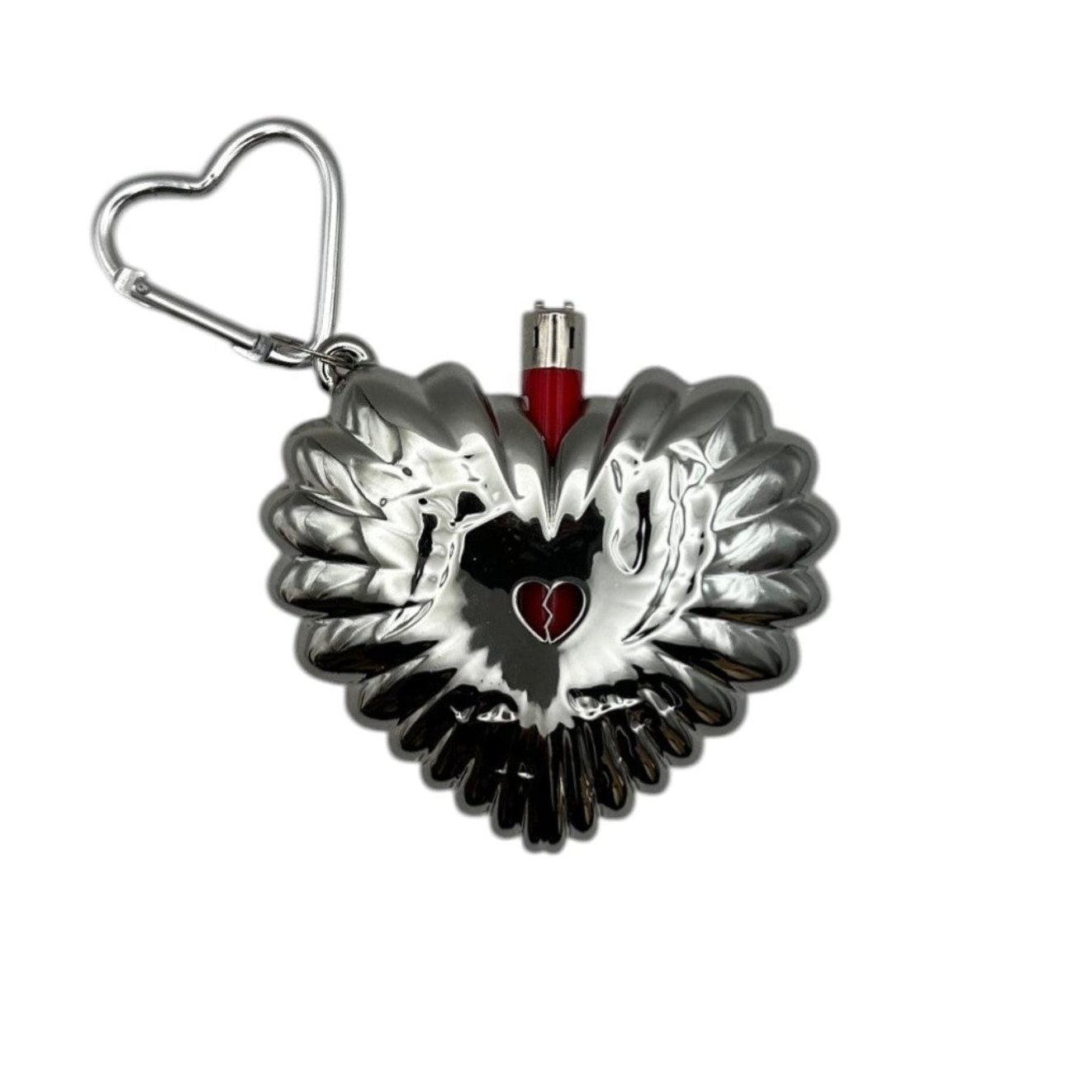 Heart-shaped metallic object with a small heart cutout and a keychain attachment, featuring a swan design inside the heart.