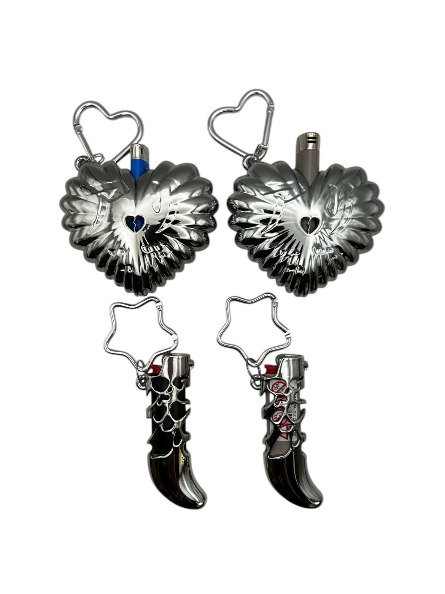 Four metallic keychains with heart and claw designs, two with heart-shaped loops, two with claw shapes, on a white background.