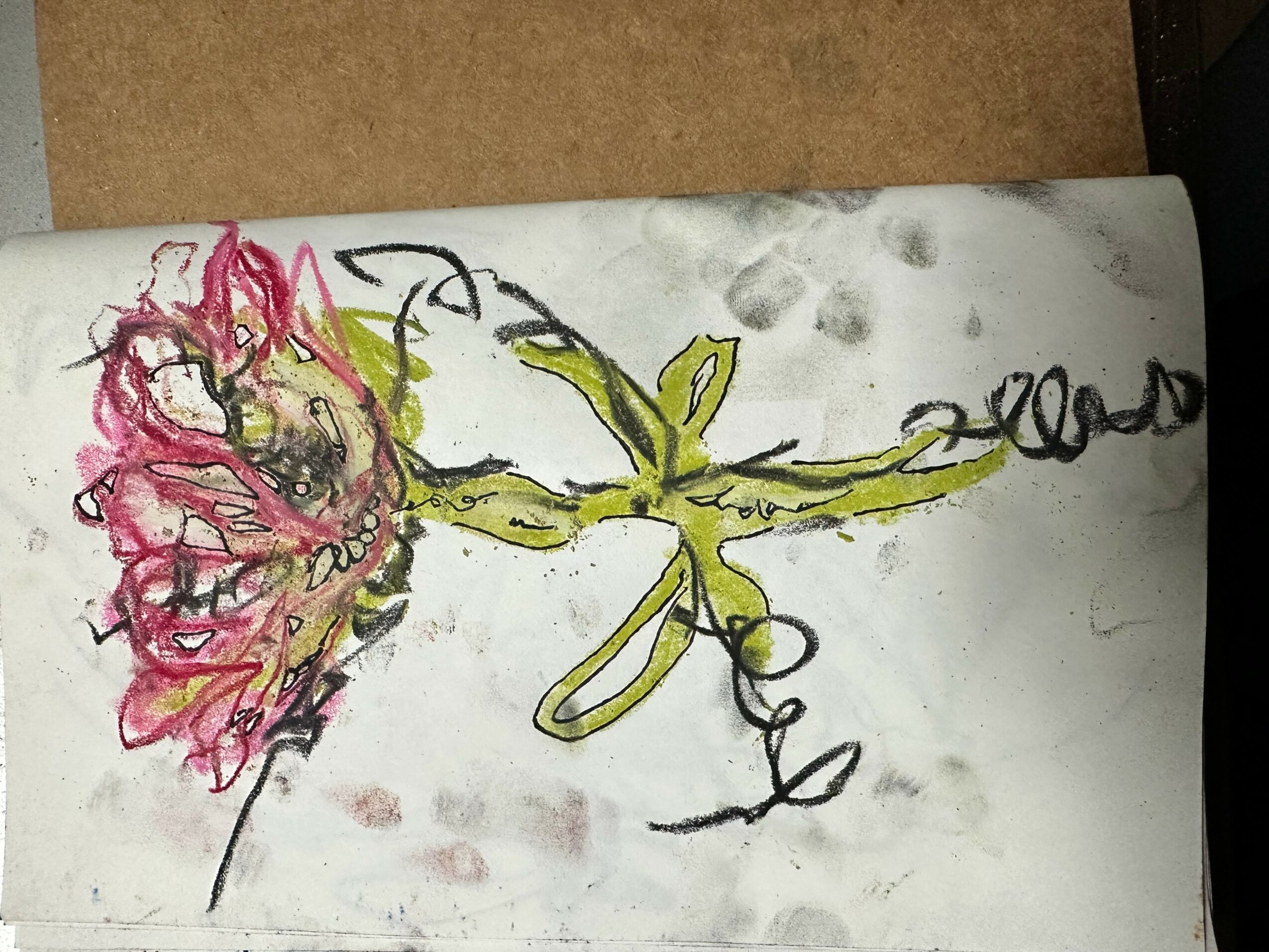 Colorful abstract drawing with pink, yellow, and black lines on white paper, featuring floral and organic shapes.