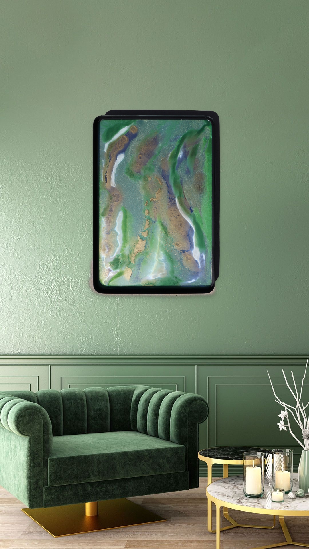 Wall-mounted abstract painting above a green velvet sofa in a living room, with a white coffee table and decorative items.