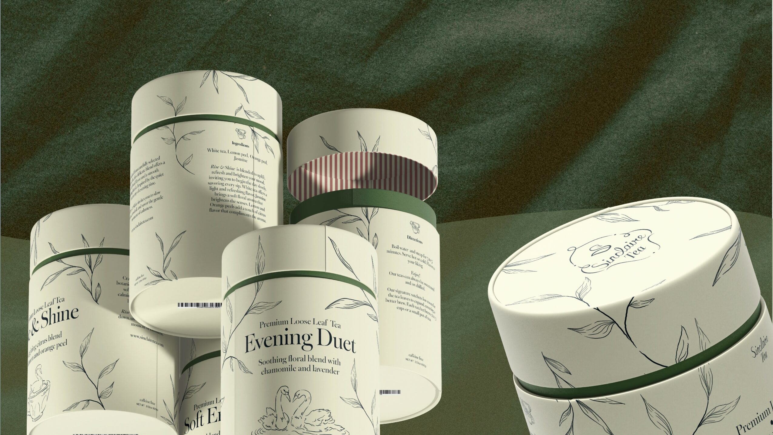 Six cylindrical containers with botanical designs on a dark green fabric background.