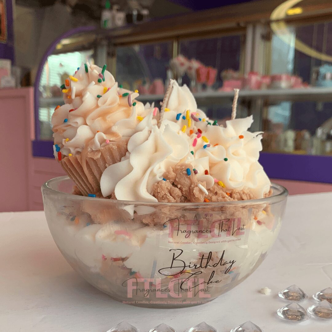 Cupcake and ice cream sundae with sprinkles in a glass bowl on a table, colorful background, birthday celebration theme.