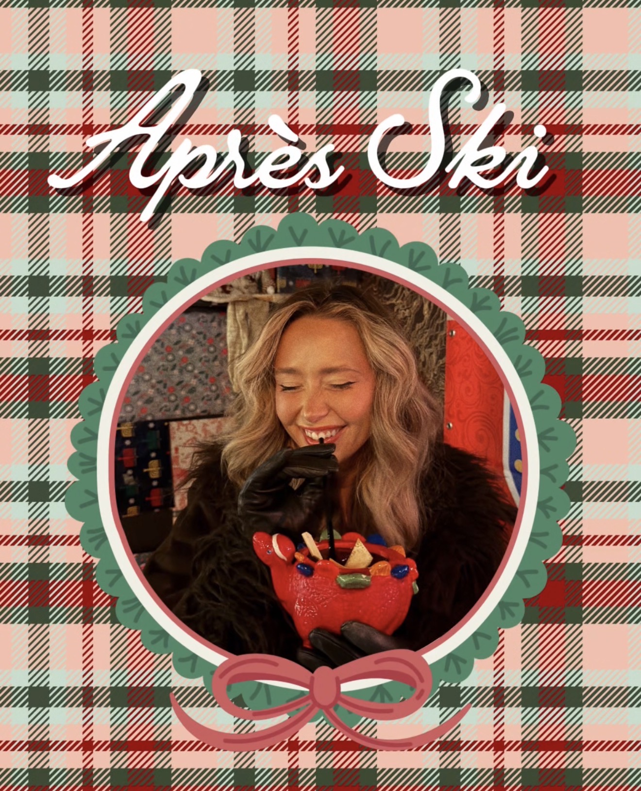A smiling woman with wavy blonde hair holding a red gift box with a bow, in front of a plaid background.