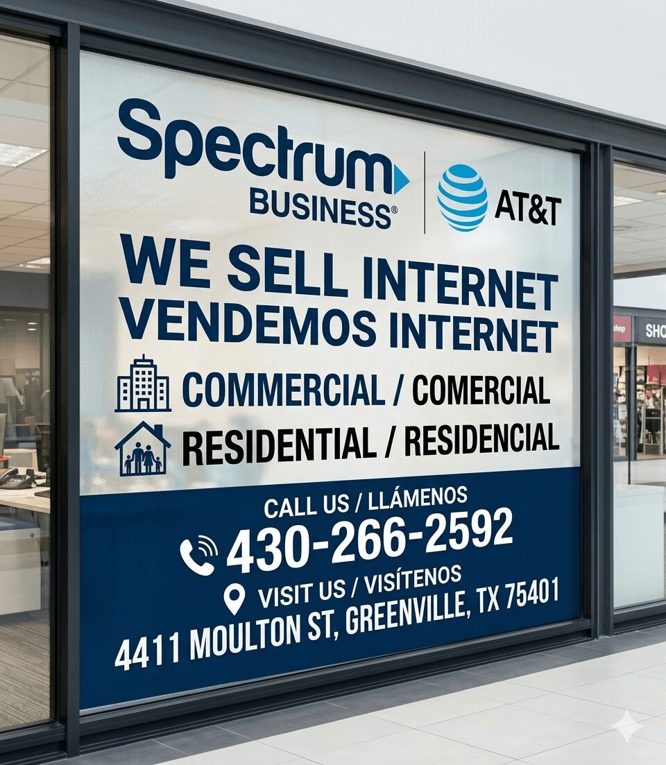 Storefront window with Spectrum Business and AT&T logos, advertising internet services, contact info, and address in Greenville, Texas.