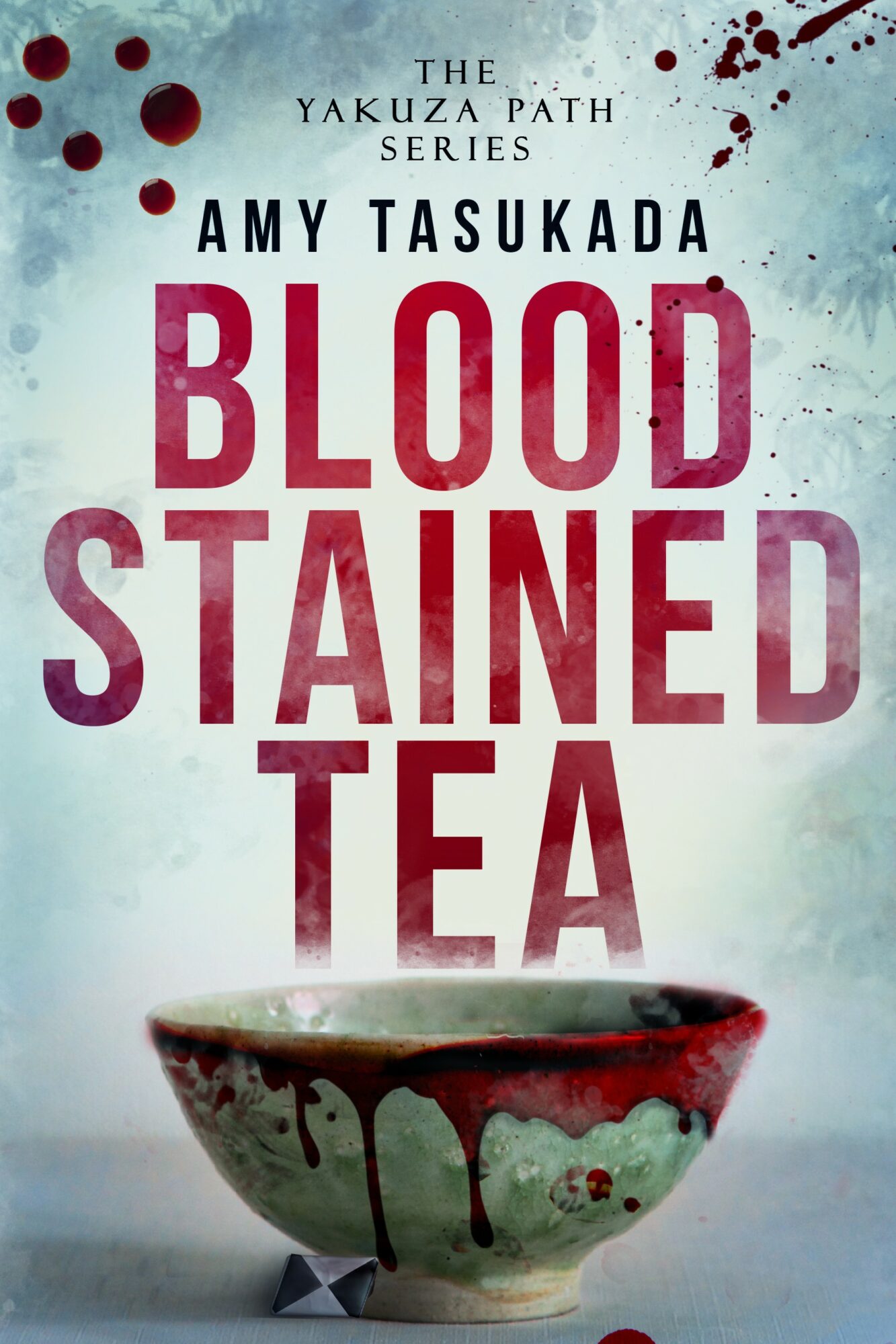Book cover with title 'Blood Stained Tea' and a bowl with blood-like stains, background is light blue with red splatters.