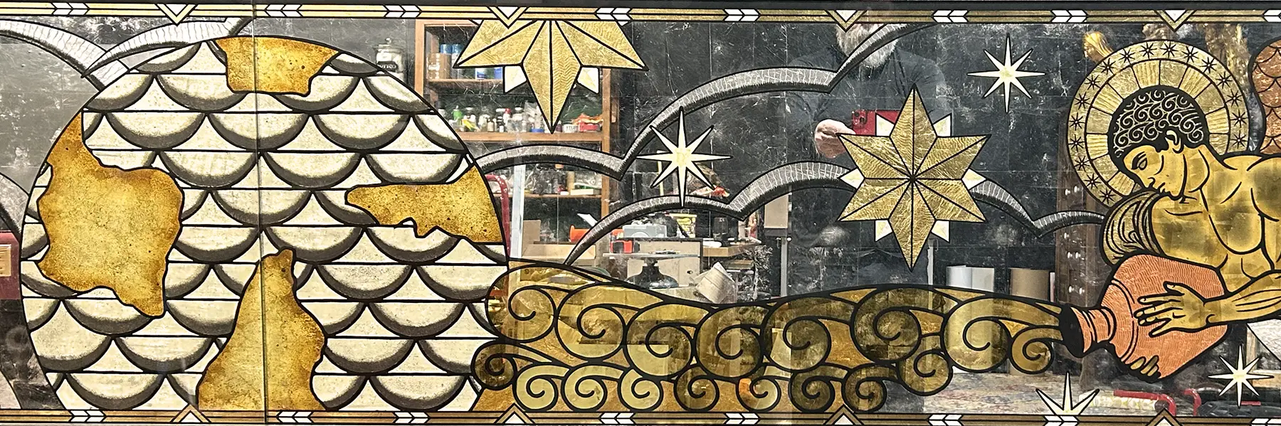 Decorative pattern with stars, clouds, and abstract shapes in gold, black, and white colors.