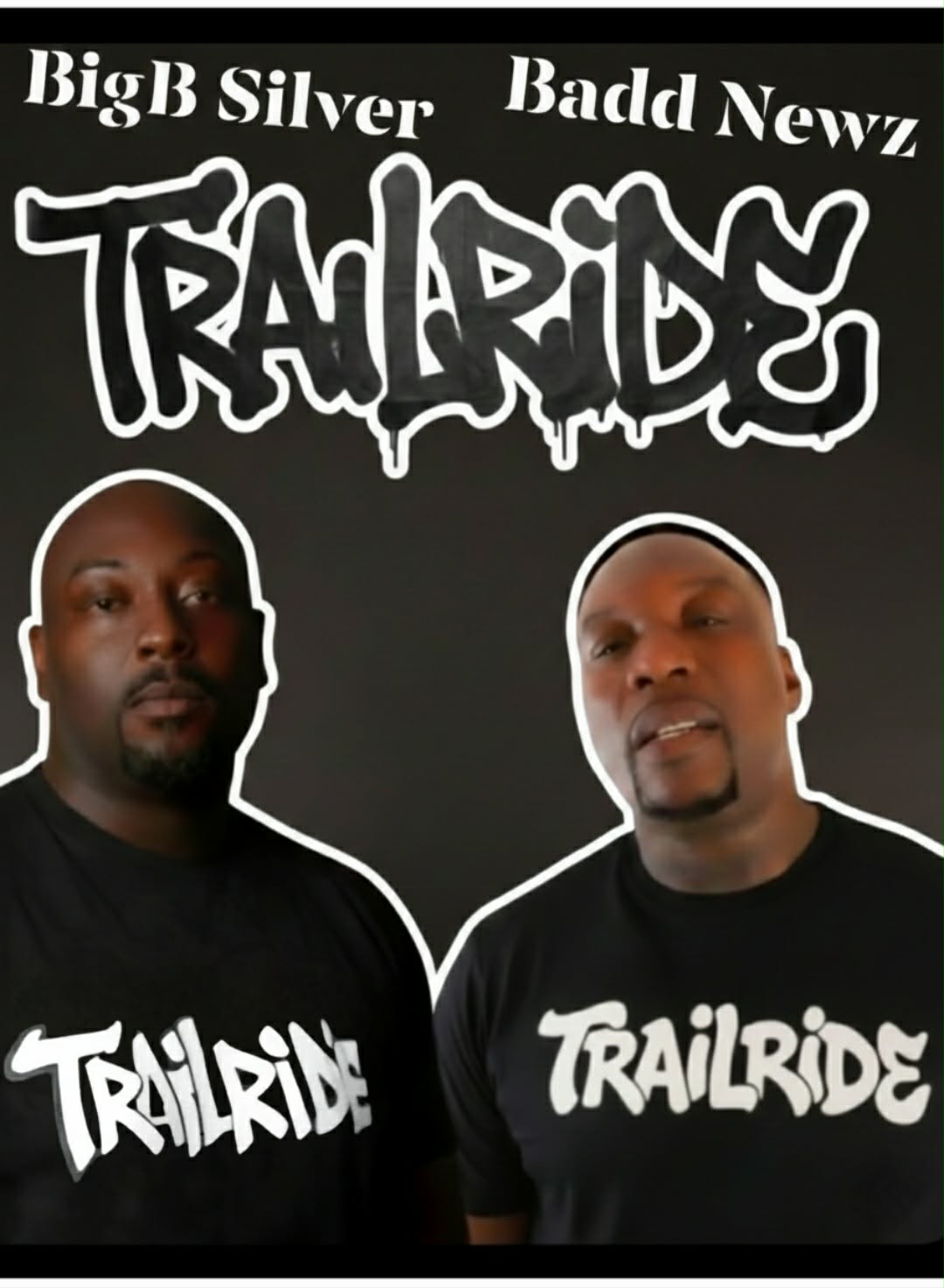Two men wearing black shirts with 'TRAILRIDE' text, standing against a black background with graffiti-style text above them.