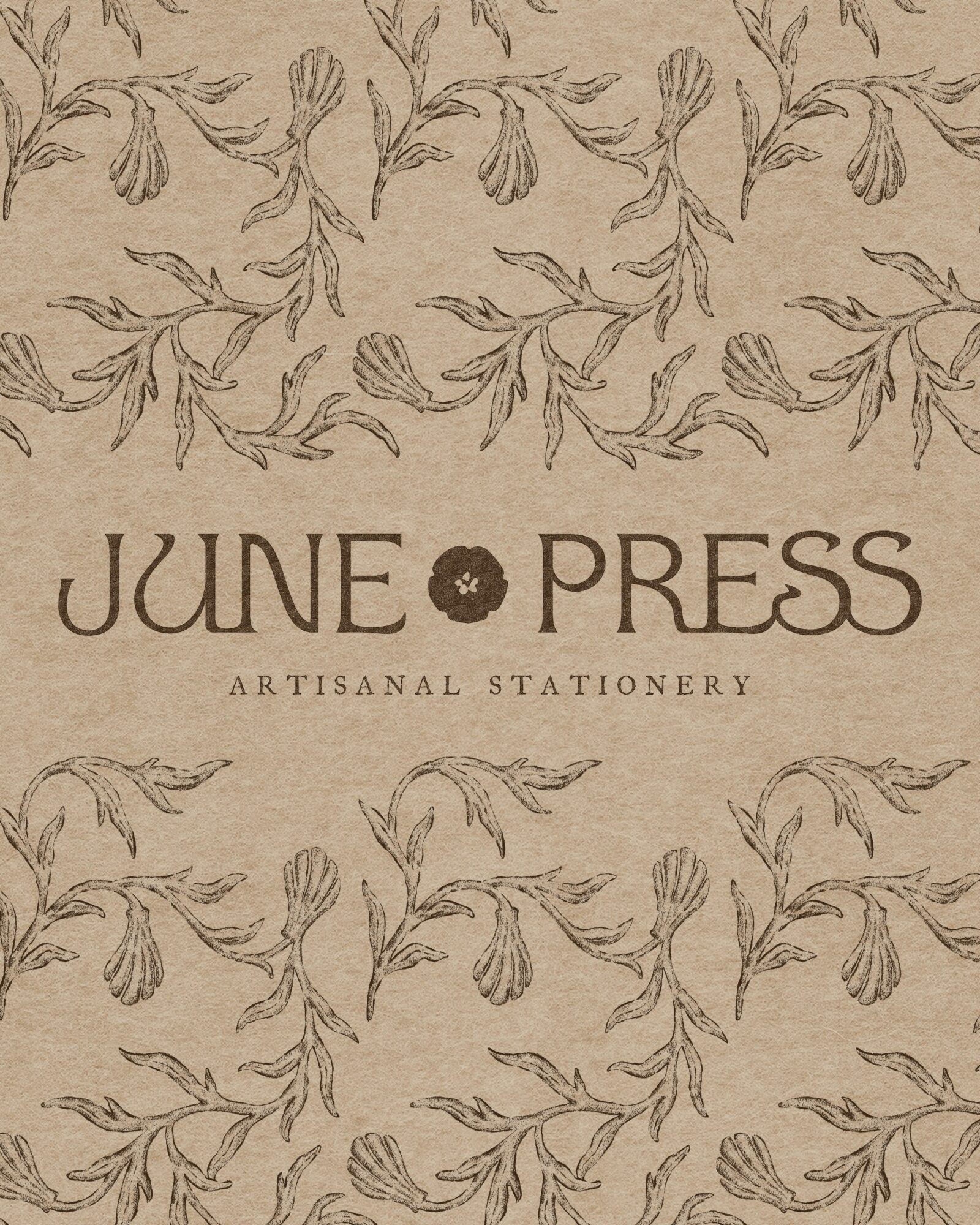 Patterned background with floral illustrations and text reading 'JUNE PRESS ARTISANAL STATIONERY'.