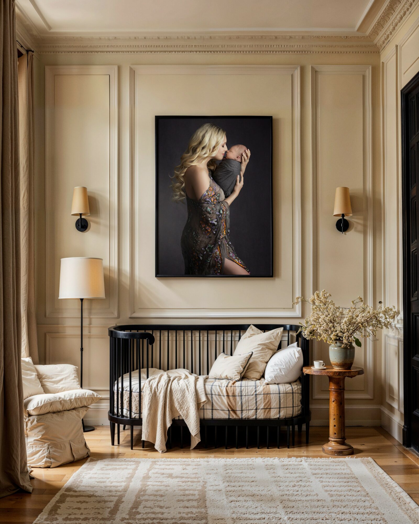 Living room with a large portrait of a woman on the wall, sofa with cushions, and a wooden side table with flowers.
