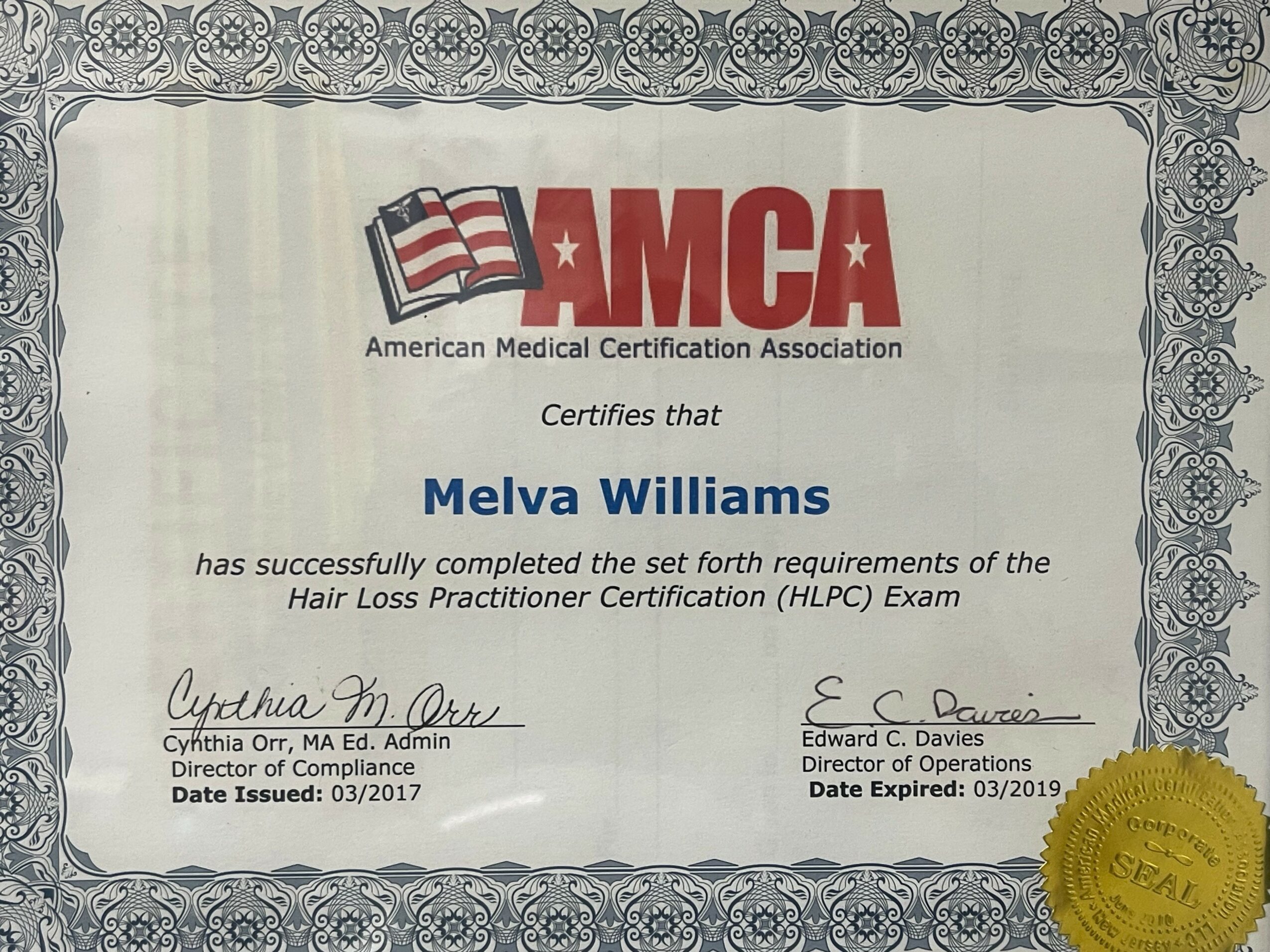Certificate from American Medical Certification Association awarded to Melva Williams for completing Hair Loss Practitioner Certification, with signatures and a gold seal.