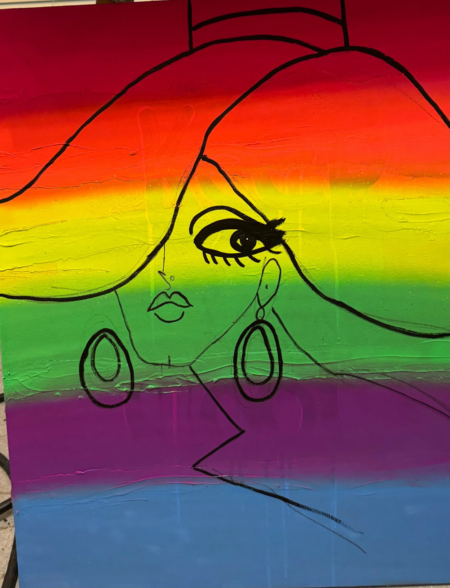Drawing of a woman's face with large earrings, over a rainbow-colored background, with black outline details.