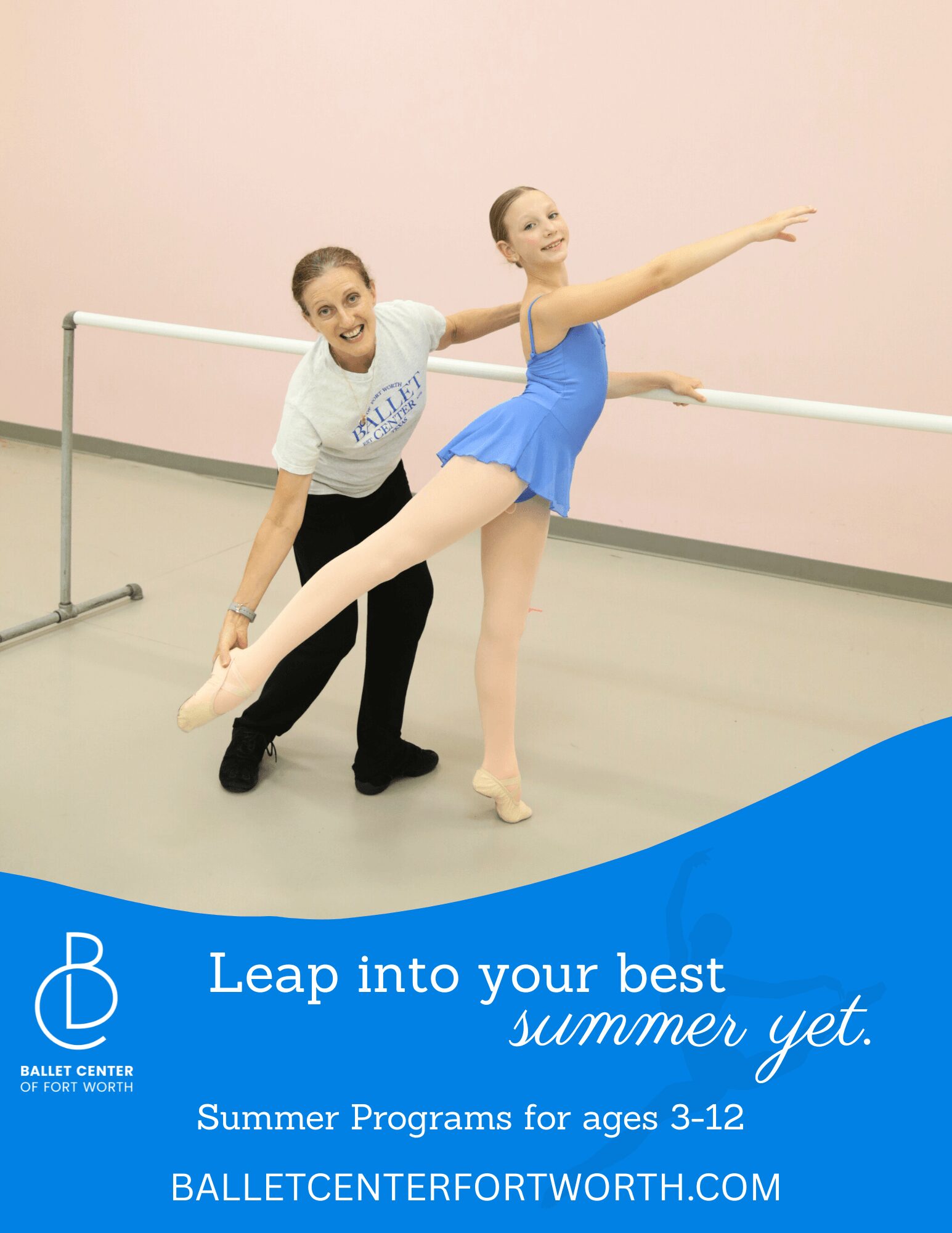Two young ballet dancers practicing at a barre in a dance studio, one assisting the other with a pose, pink wall background.