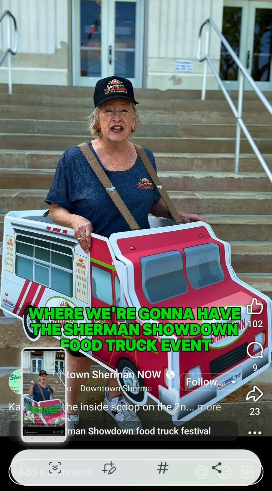 Older woman standing outdoors with two colorful toy trucks, stairs and building in background, smiling at camera.