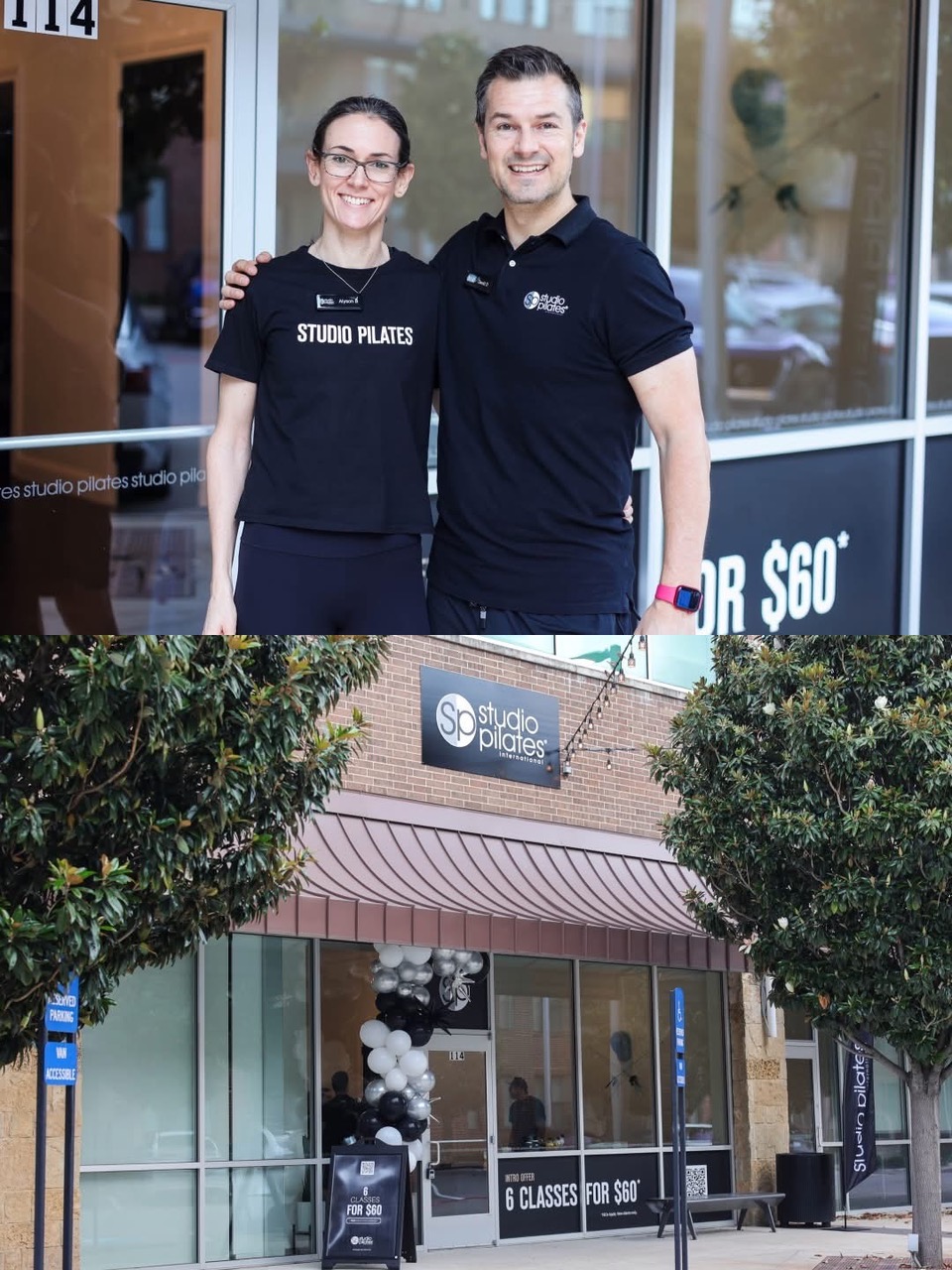 Two people standing outside a fitness studio, smiling, with a sign for classes and a window showing the interior.