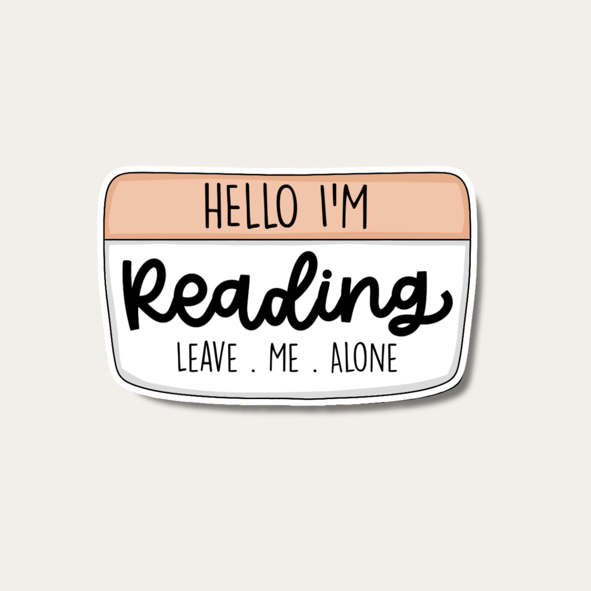 A badge with text: Hello I'm Reading Leave me alone, with a peach and white background.