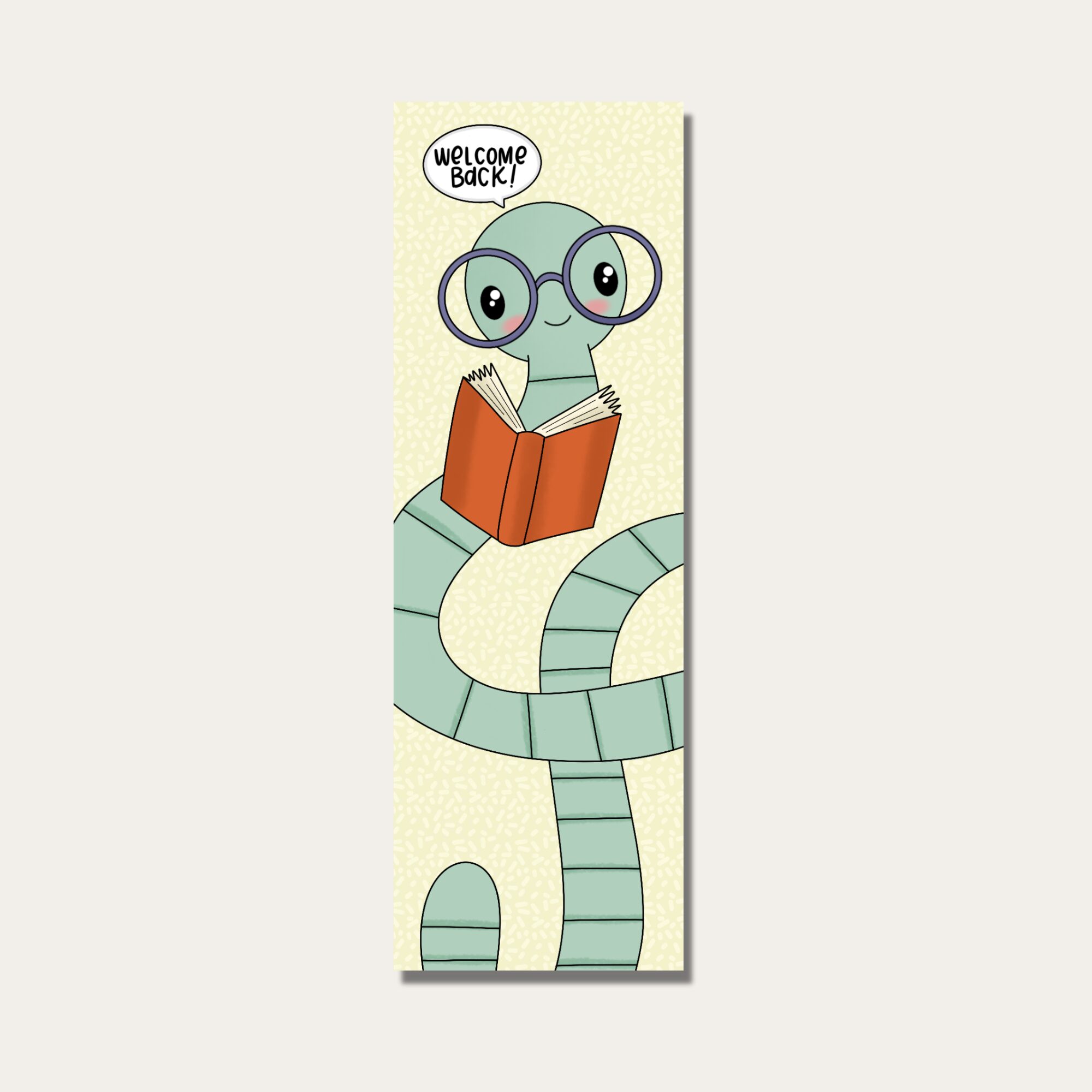 Cartoon snake with glasses reading a book, with a speech bubble saying 'Welcome Back!'.