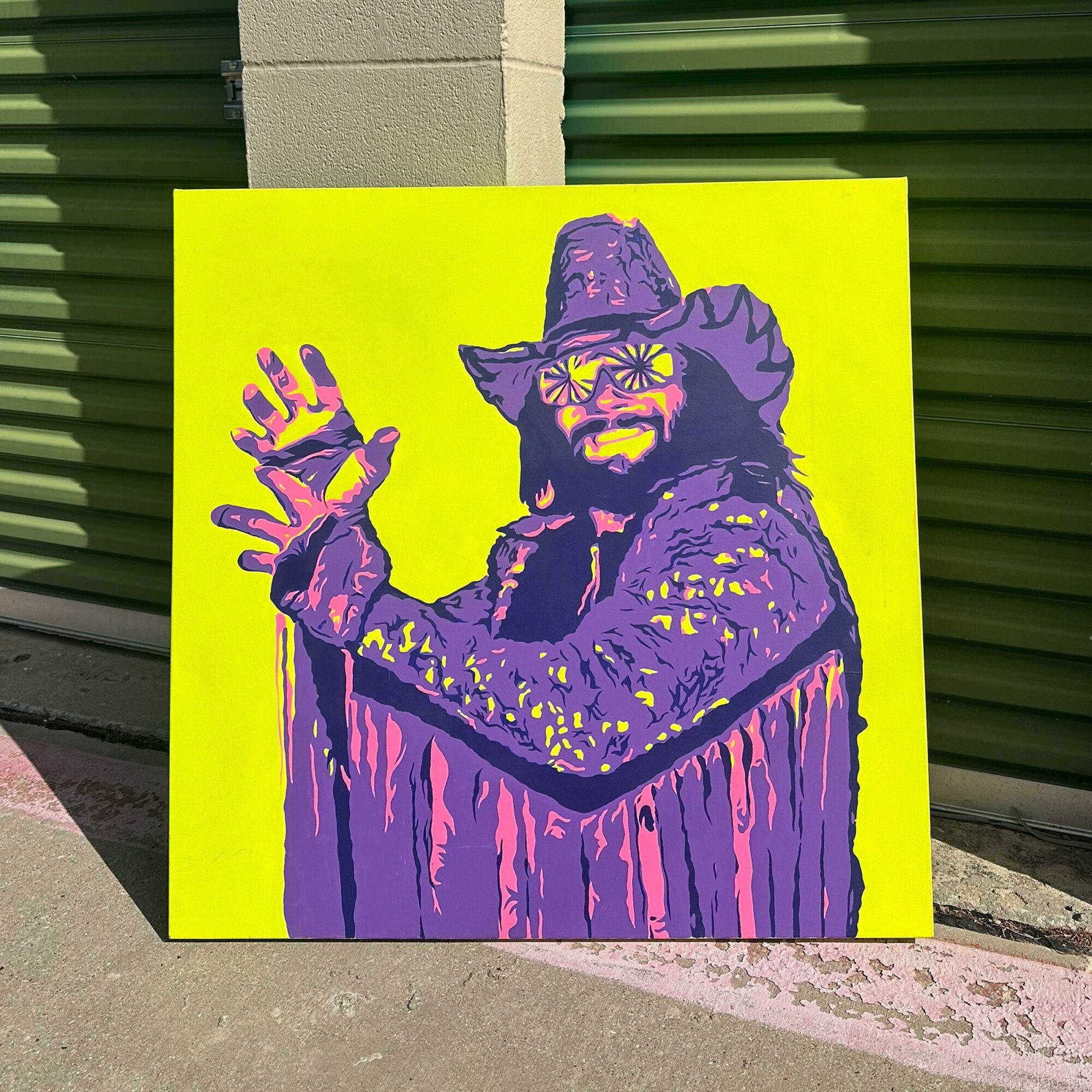 Colorful painting of a person with a hat, glasses, and beard, waving, on a bright yellow background.