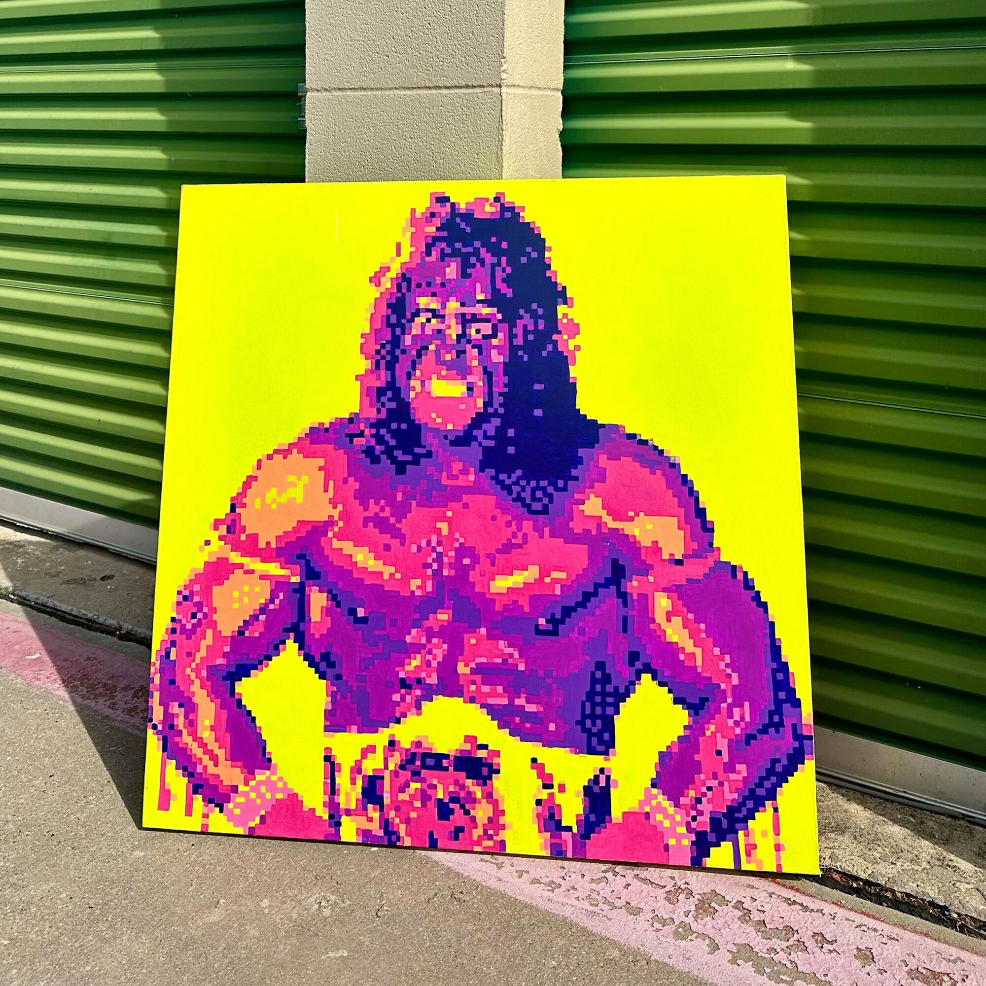 Pixelated colorful portrait of a muscular person with long hair, wearing a championship belt, against a yellow background.