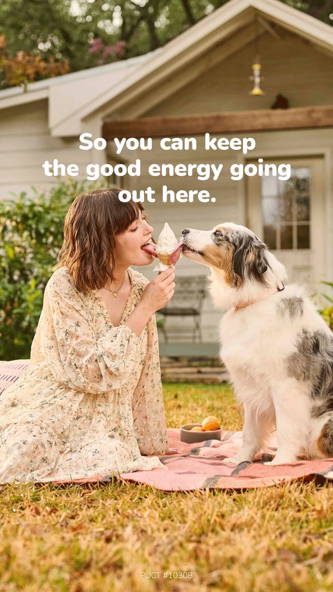 Woman and dog sharing a treat outdoors in front of a house, with text about keeping good energy.