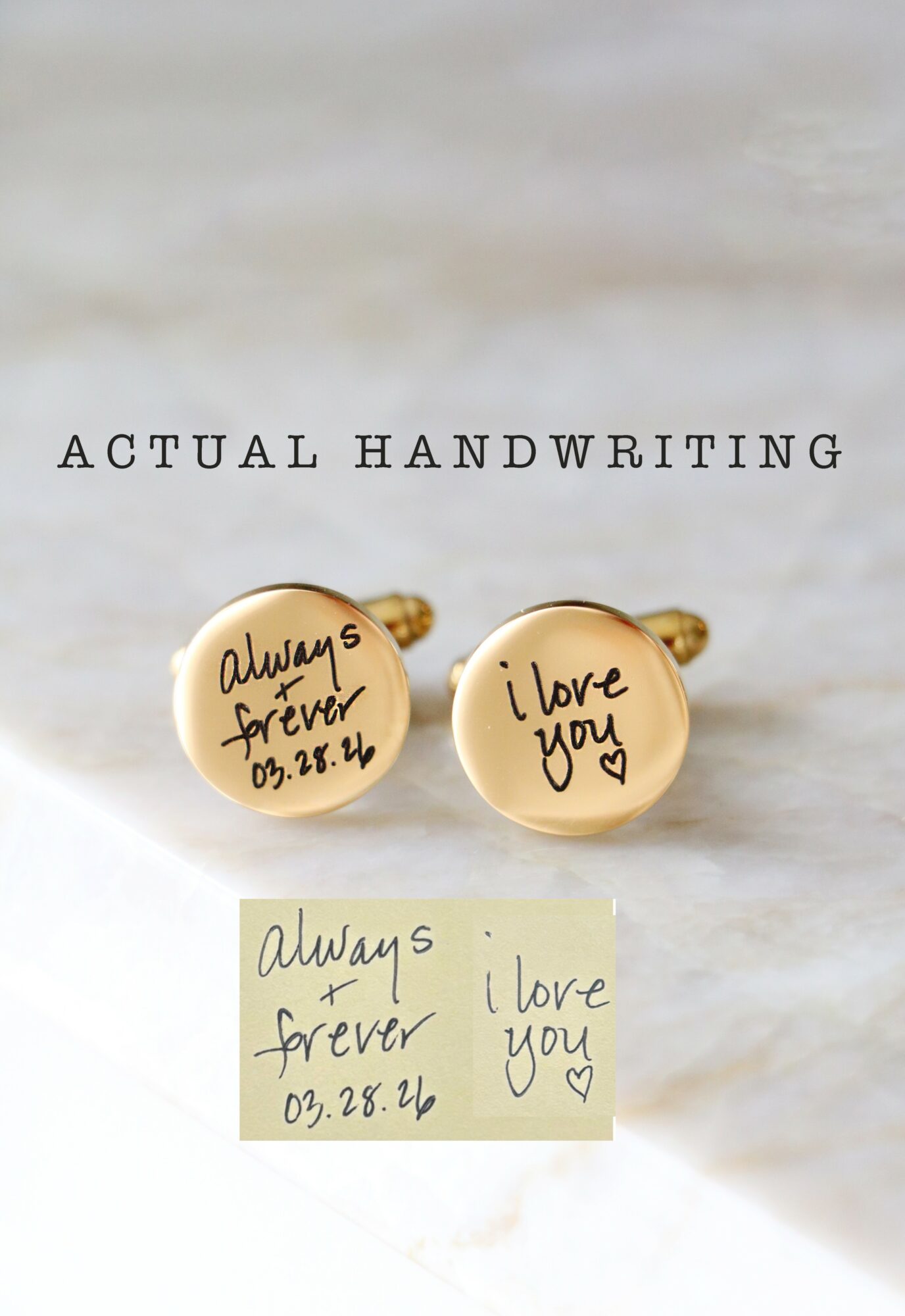 Two gold-colored cufflinks with handwritten messages, one reading 
