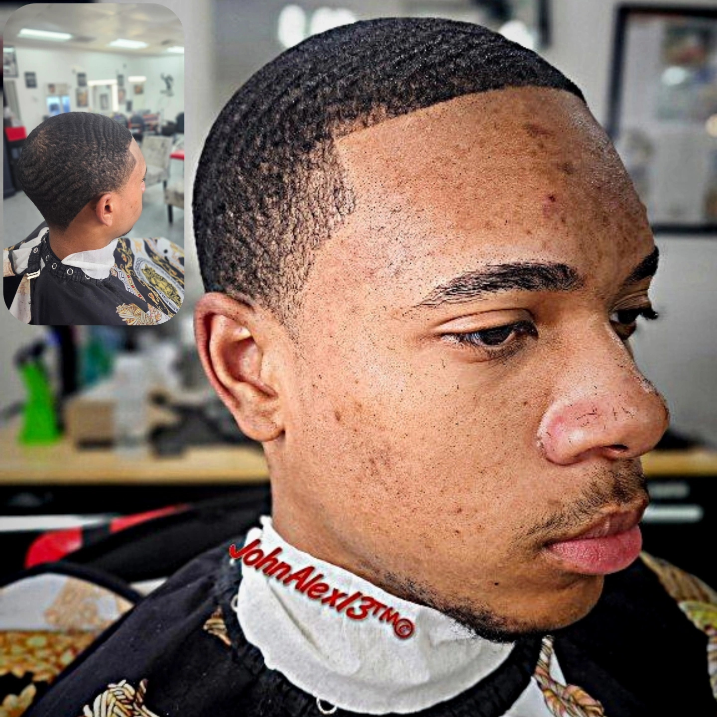 Close-up of a young man with a fresh haircut, textured hair, and facial acne, in a barbershop setting.