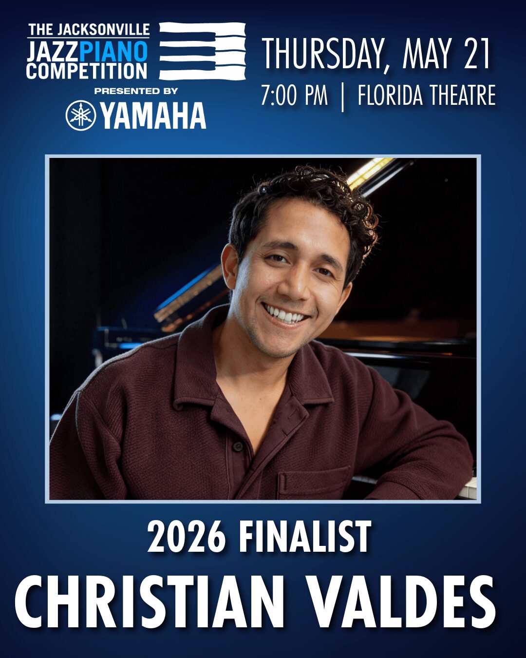 Young man smiling, wearing a dark shirt, with a piano in the background, promoting a jazz competition event.