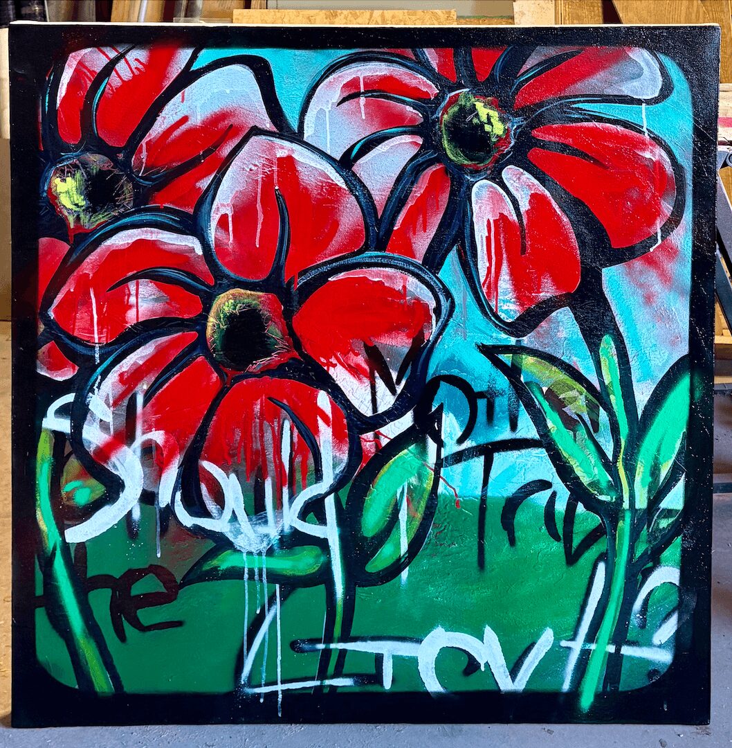 Bright red flowers with black centers and green stems on a colorful background, painted in a graffiti style.