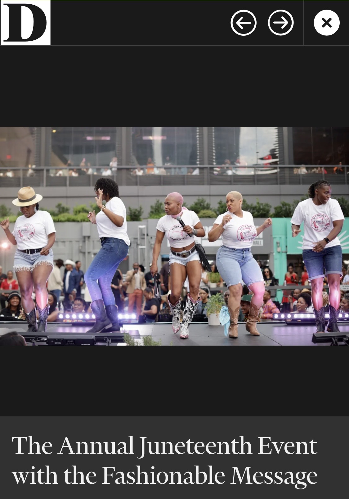 Six people dancing outdoors during daytime, wearing casual clothing and pink knee-high socks, with a cityscape background.