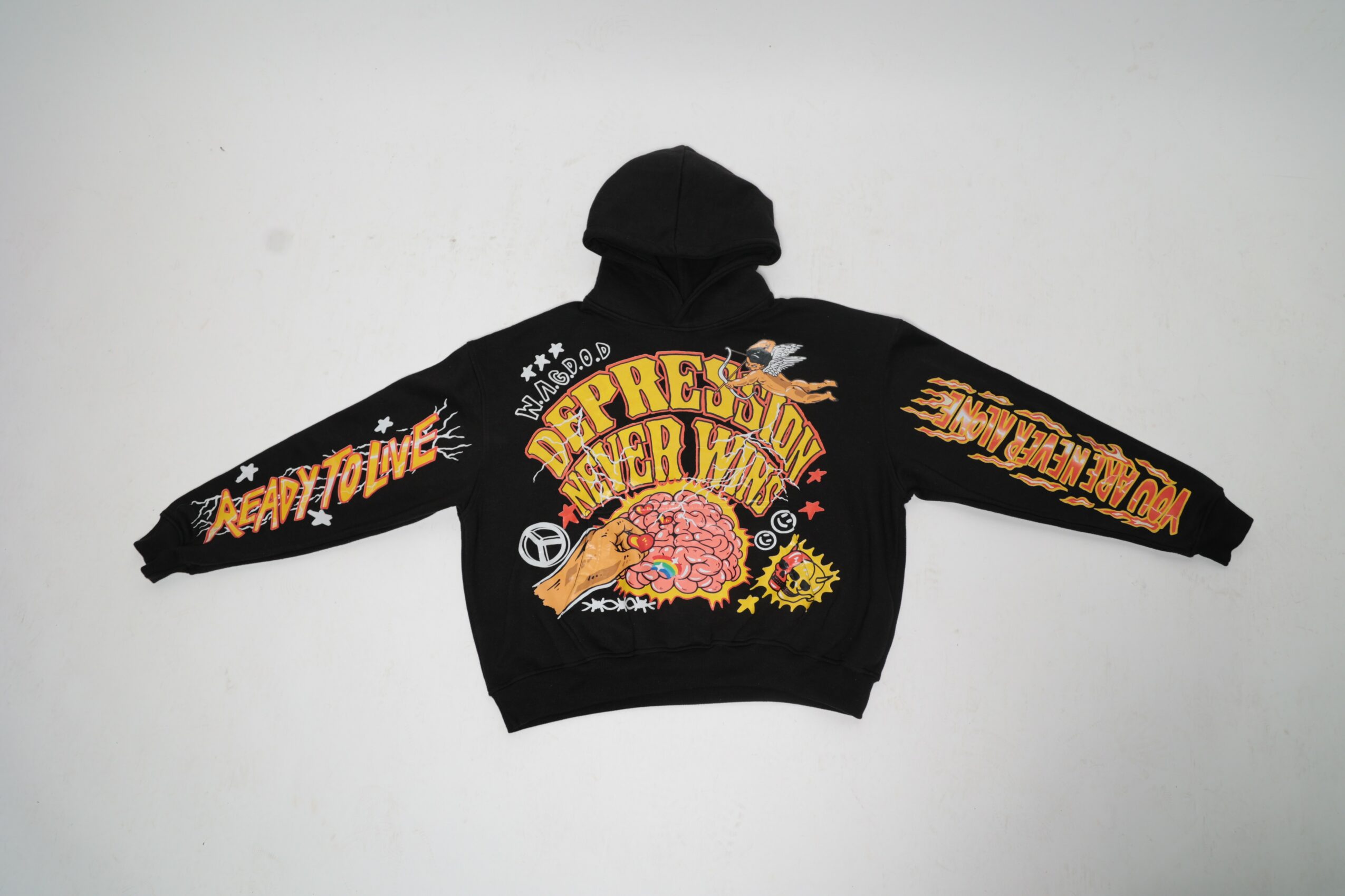 Black jacket with colorful embroidered text and designs, spread out on a white background.