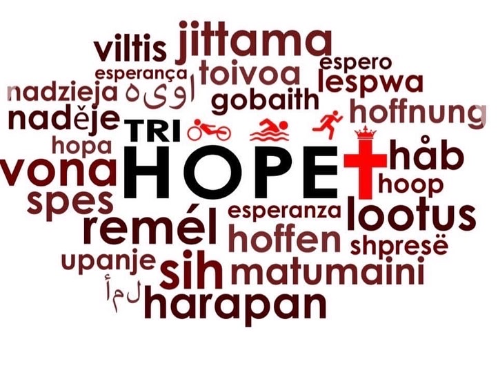 Word cloud with 'HOPE' in the center, surrounded by words in various languages and a red cross symbol.