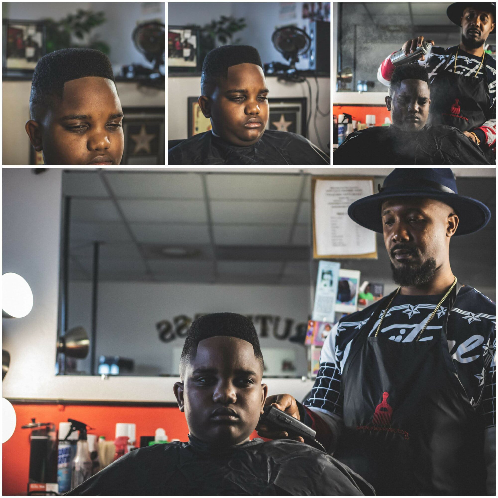 A person getting a haircut in a barbershop with a barber wearing a hat and striped shirt, and a mirror in the background.