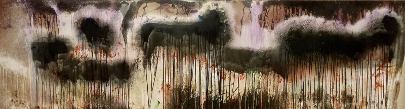 Abstract graffiti with dark shapes and dripping paint on a wall.