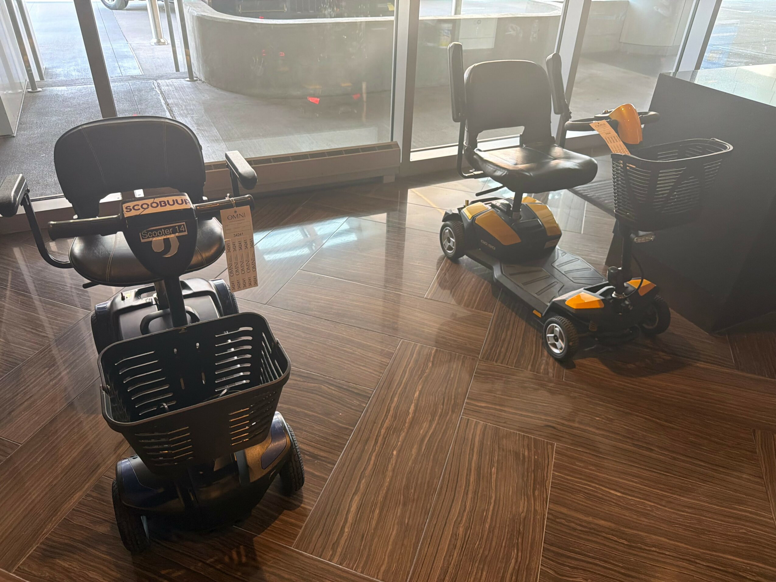 Indoor space with chairs, a small ride-on toy, and a window with a view outside.