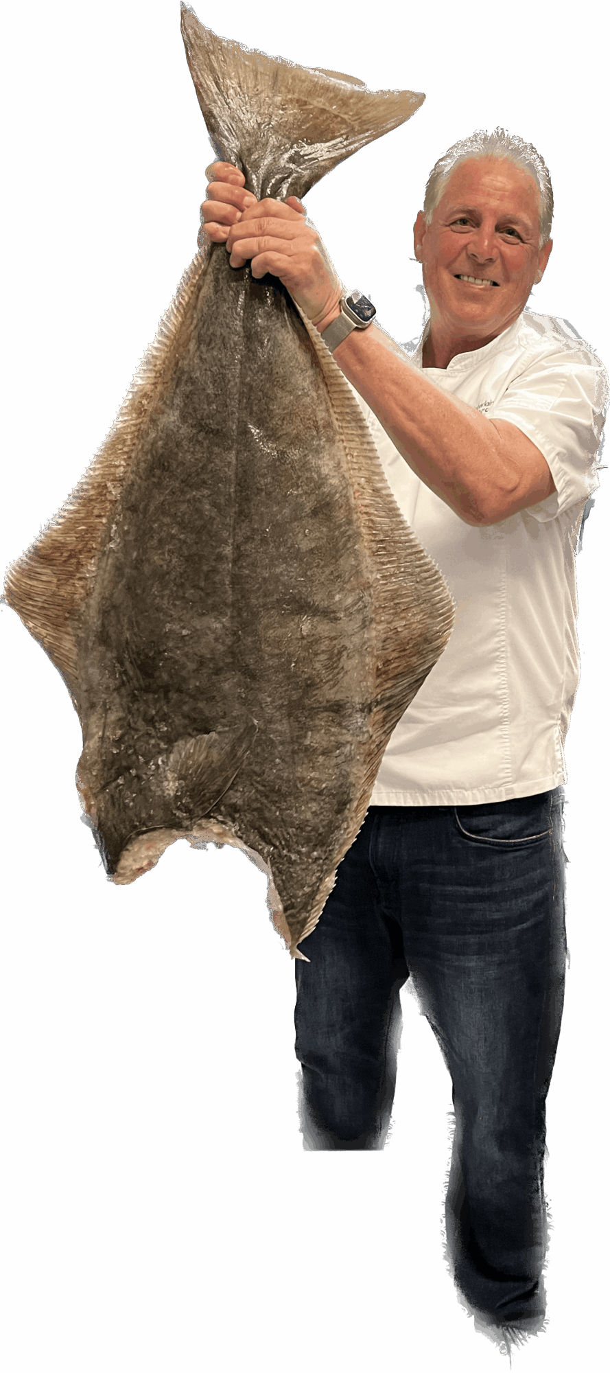 Man holding a large animal hide, smiling, against a black background.