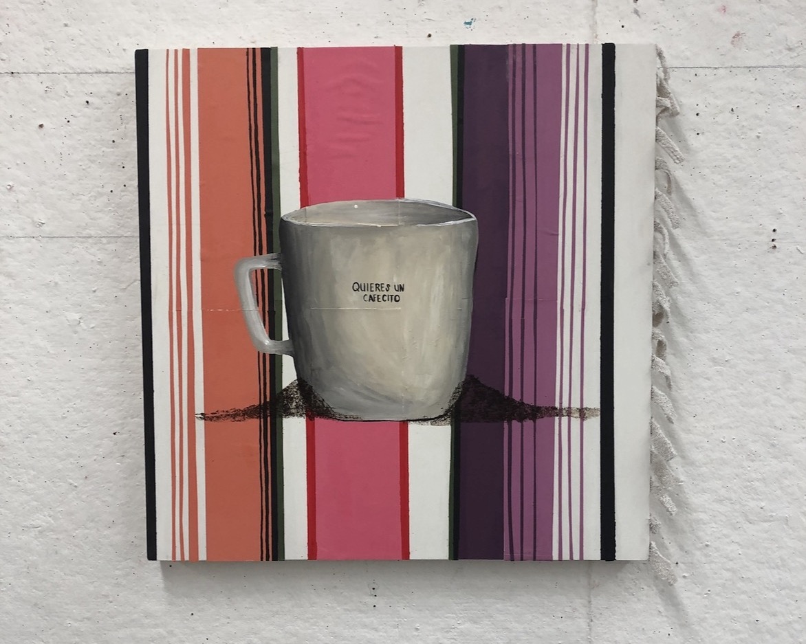 A gray mug with text on it, placed on a colorful striped background, with a shadow cast on the surface.