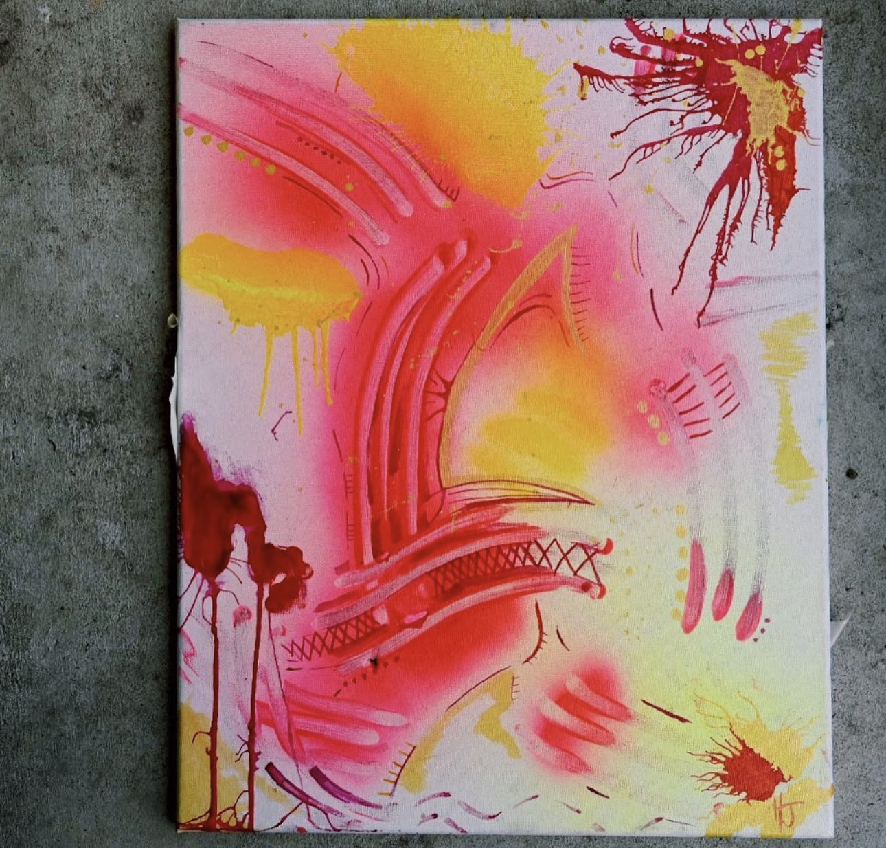 Abstract painting with pink, yellow, and red splashes and lines on a white background.