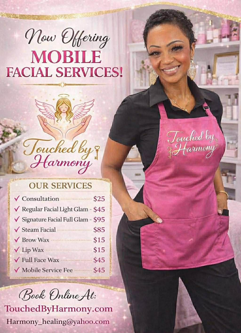 Smiling woman in black shirt and pink apron standing in front of a sign advertising mobile facial services, list of treatments and prices.