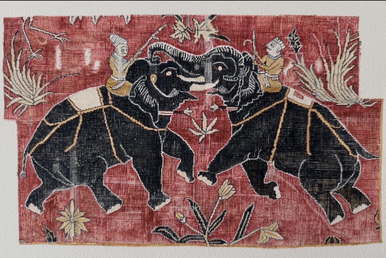 Two elephants face each other with riders, set against a red background with floral and leaf patterns, in a traditional style.