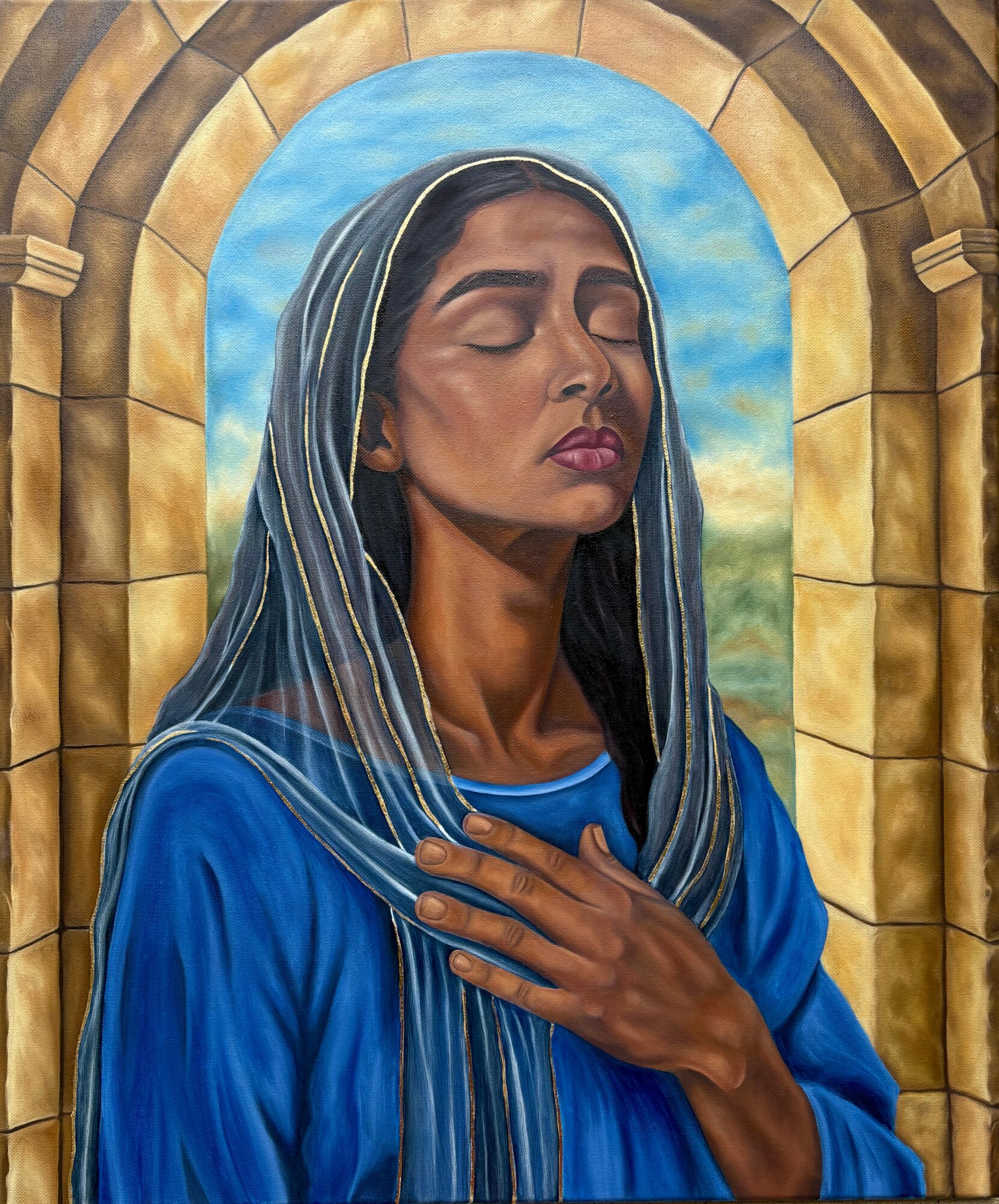A woman with closed eyes and a serene expression, wearing a blue garment and a striped head covering, with a stone arch and sky background.