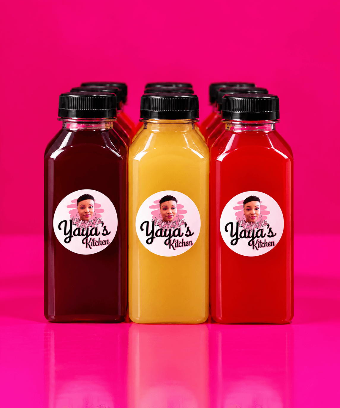 Three bottles with labels featuring a child's face and the text 'Yaya's Kitchen' against a pink background.