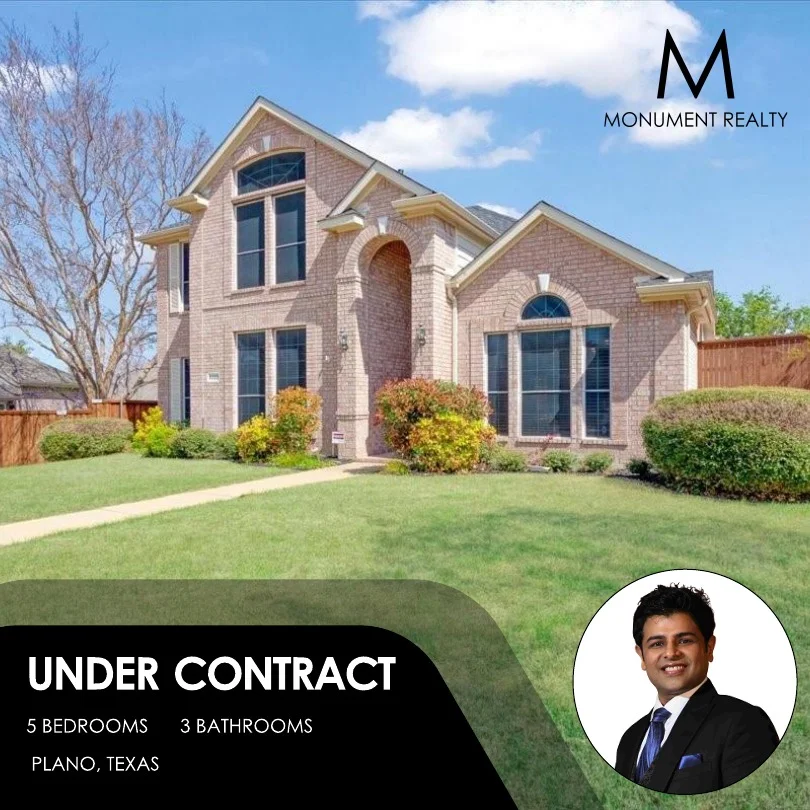 Two-story brick house with large windows and a well-maintained lawn, under a blue sky with clouds. A person in a suit is in a circular inset. Monogram logo and text in the top right corner.